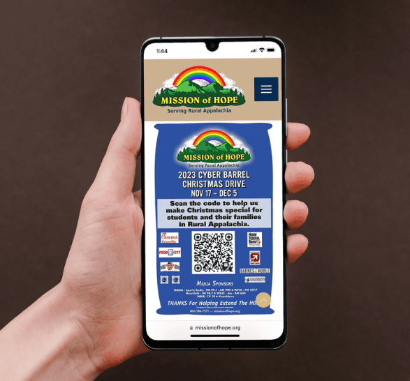 A person holding up a smartphone with a qr code on it.