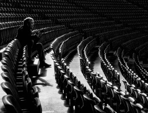 person needs space sitting alone in bleachers