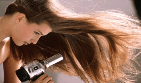 woman blow dry hair