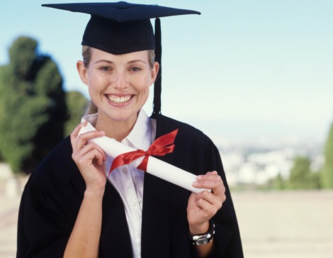 Girl with diploma in graduation gown