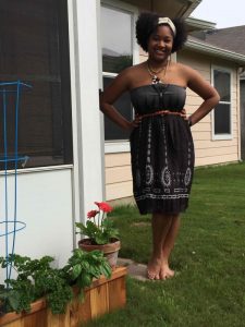 Girl wearing dress in the backyard of her home