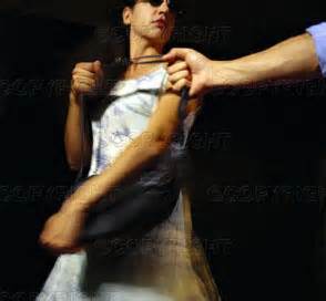 woman with muscles self-defense as man tries to steal her purse