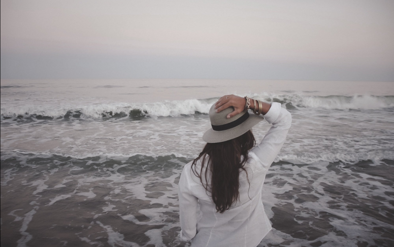 woman traveling alone at the ocean