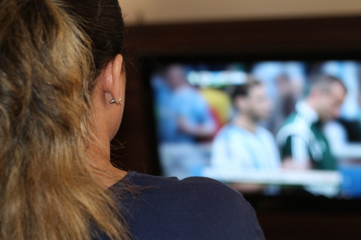 woman watching sports on TV