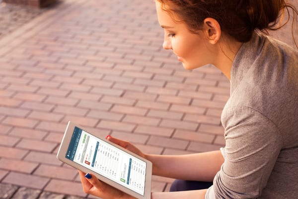 woman looking at iPad lexington law