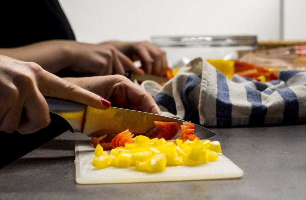 woman cutting vegetables