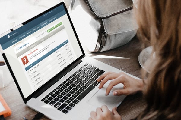 woman working on laptop on wood table