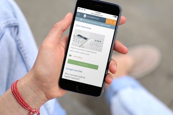 woman holding cell phone