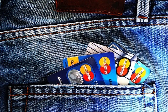 6 Super Easy Ways To Gain Tons Of Credit Card Rewards four credit cards in pocket of jeans