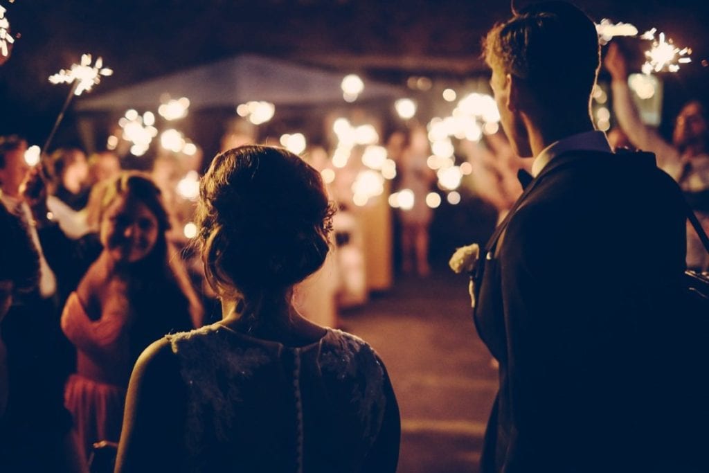 Free-Photos on Pixabay two people at their wedding with sparklers in the background