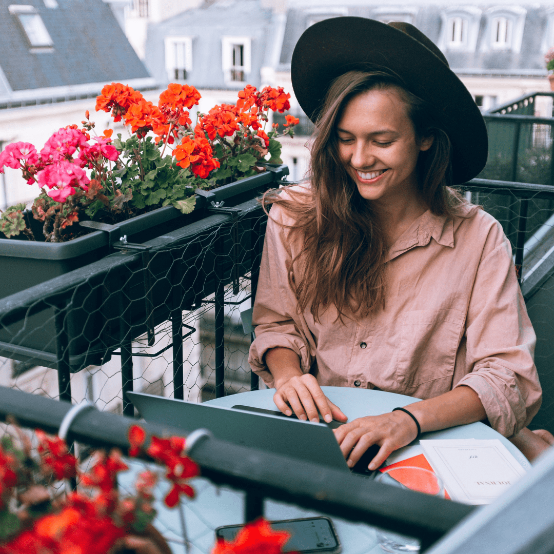 person wearing a black hat sitting outside in Paris