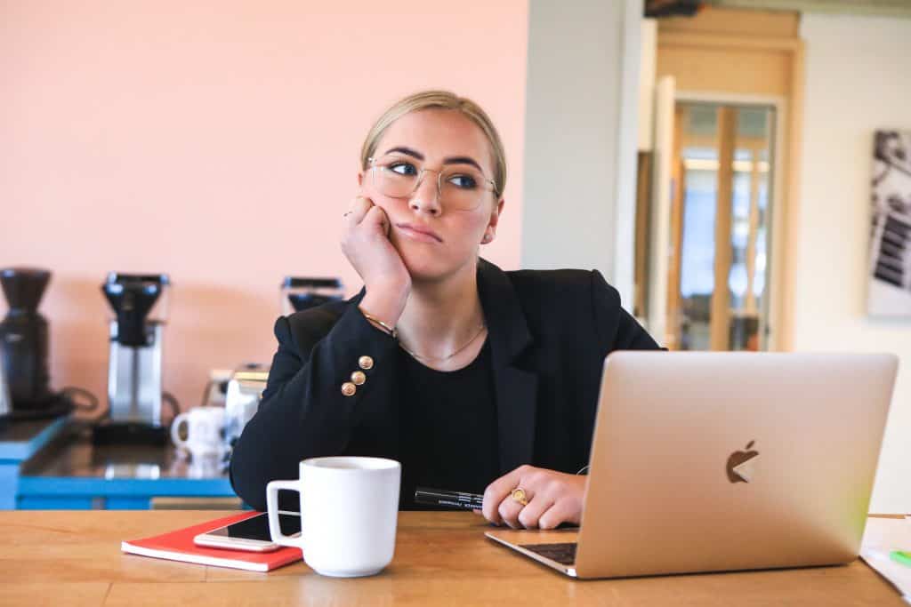 Woman bored at her desk