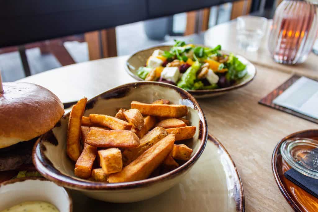 French fries and a salad on a table