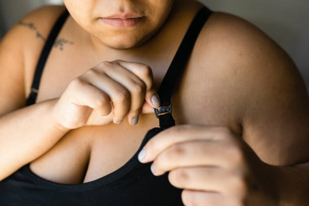 women clasping a bra