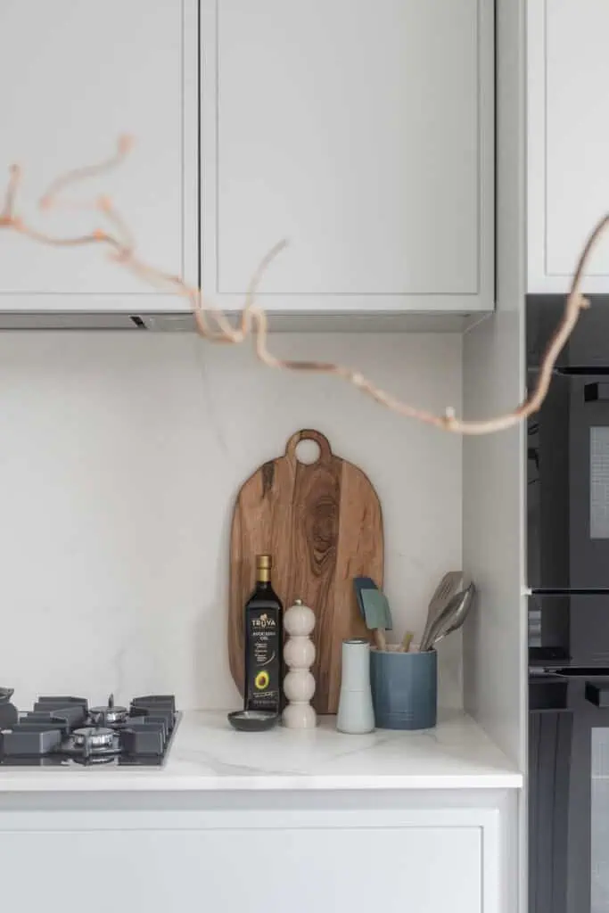 Modern kitchen interior with minimalist design and natural wood accents.
