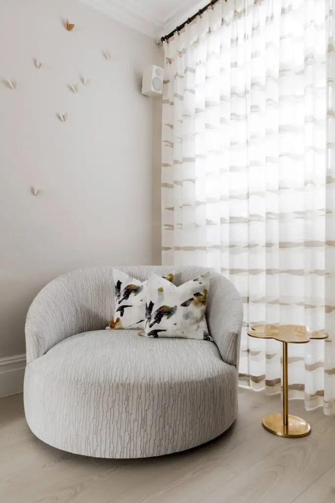 Elegant Victorian-style interior design with soft neutral tones and modern accents.