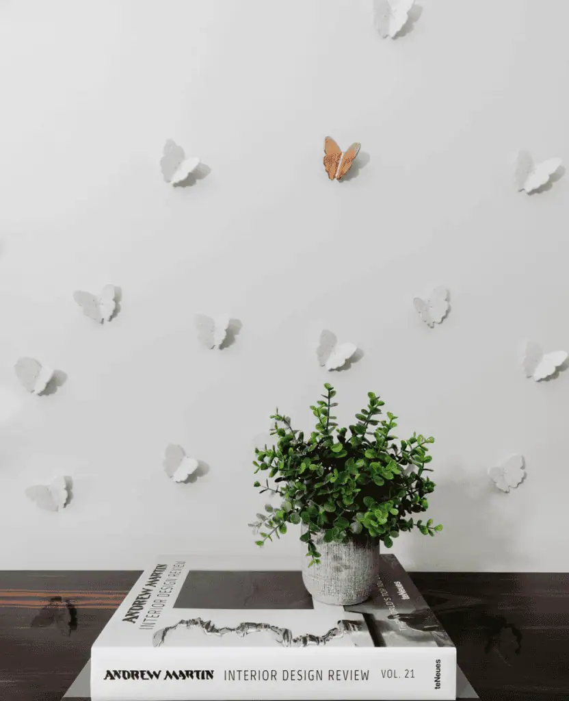 Butterflies and green plant wall decor in a contemporary interior setting.