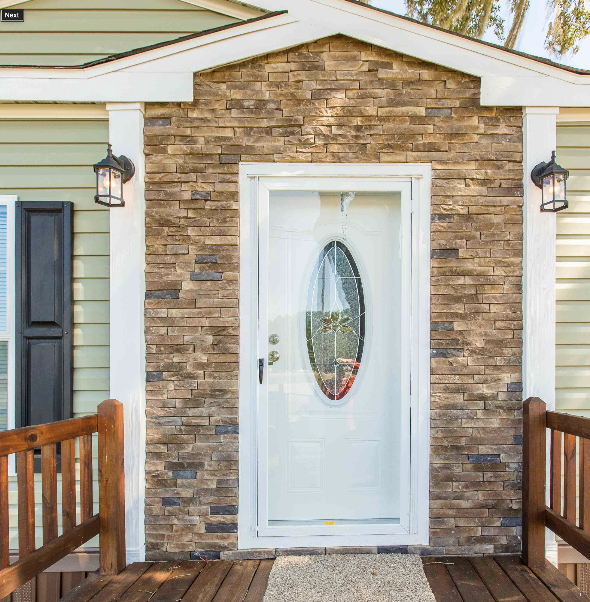 Manufactured home with new siding and front lawn