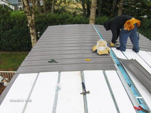 MOBILE HOME ROOF OVER - INSTALL ONE INCH THICK STYROFOAM INSULATION BETWEEN THE METAL FURRING STRIPS. THIS ADDS SUPPORT FOR OUR NEW ROOF PANELS
