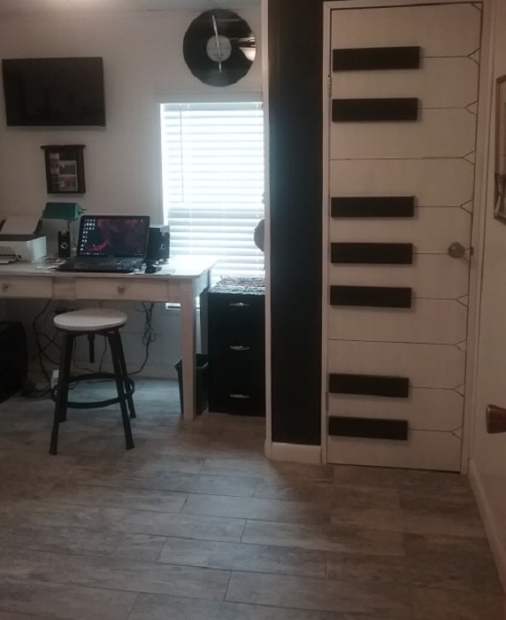 Beach theme mobile home Office with piano keys on the wall