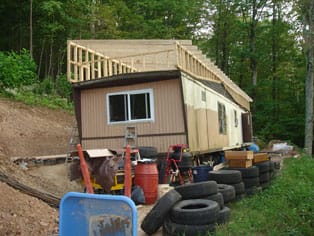 new roof on green mobile home remodel
