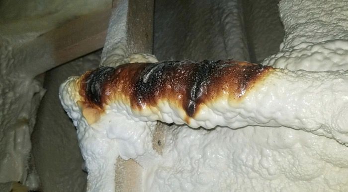 heat tape was too insulated with wrong material and burnt sprayed foam