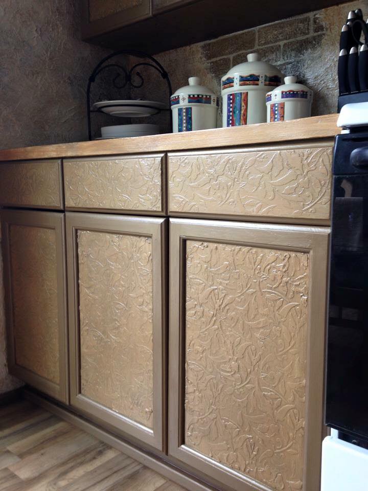 kitchen cabinets with raised stencil treatment and faux painting