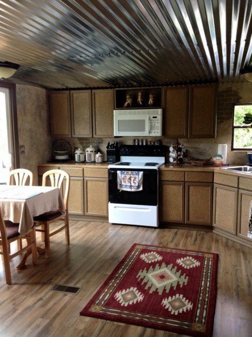 kitchen after mobile home renovation in rustic western country theme