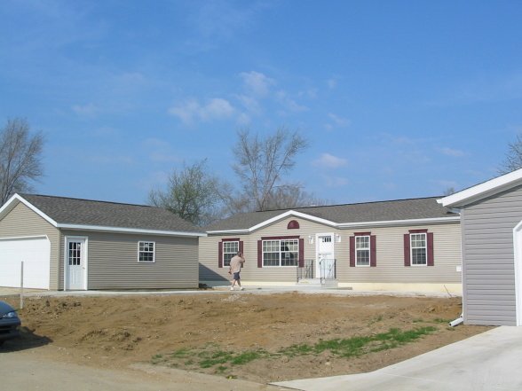 landscaping in a mobile home community - before