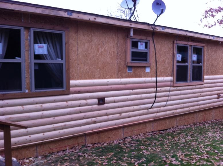 manufactured home remodel - new siding being installed