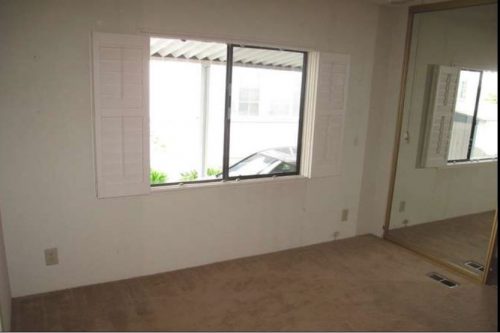 beach themed mobile home transformation-master bedroom before