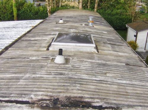 old metal roof before mobile home roof over