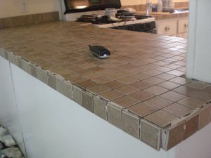 double wide manufactured home makeover - stone tile installed on kitchen cabinet