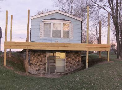 should you buy an older mobile home and remodel it? single wide exterior remodel - deck being built around manufactured home