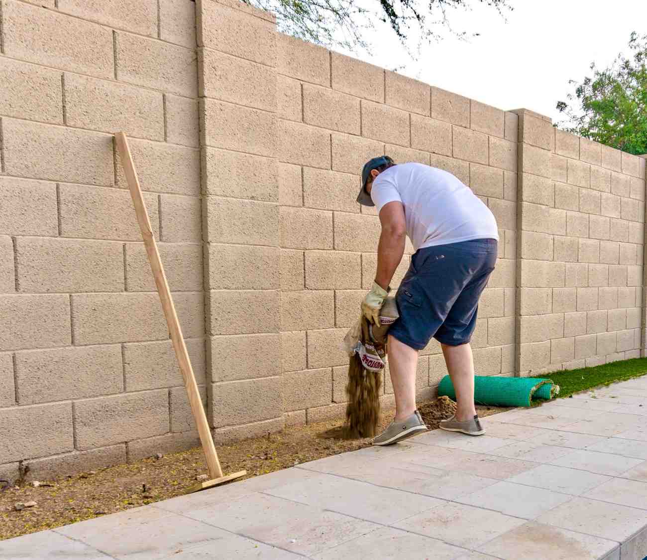 adult-male-pouring-sand-to-prepare-a-level-surface-2026-01-07-00-38-52-utc (1)