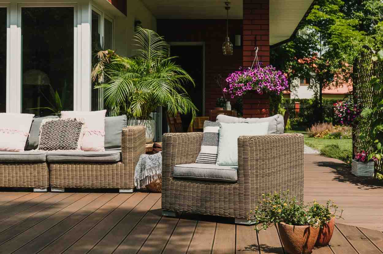 comfy-wicker-armchair-with-pillows-on-wooden-terra-2026-01-05-06-23-45-utc (1)