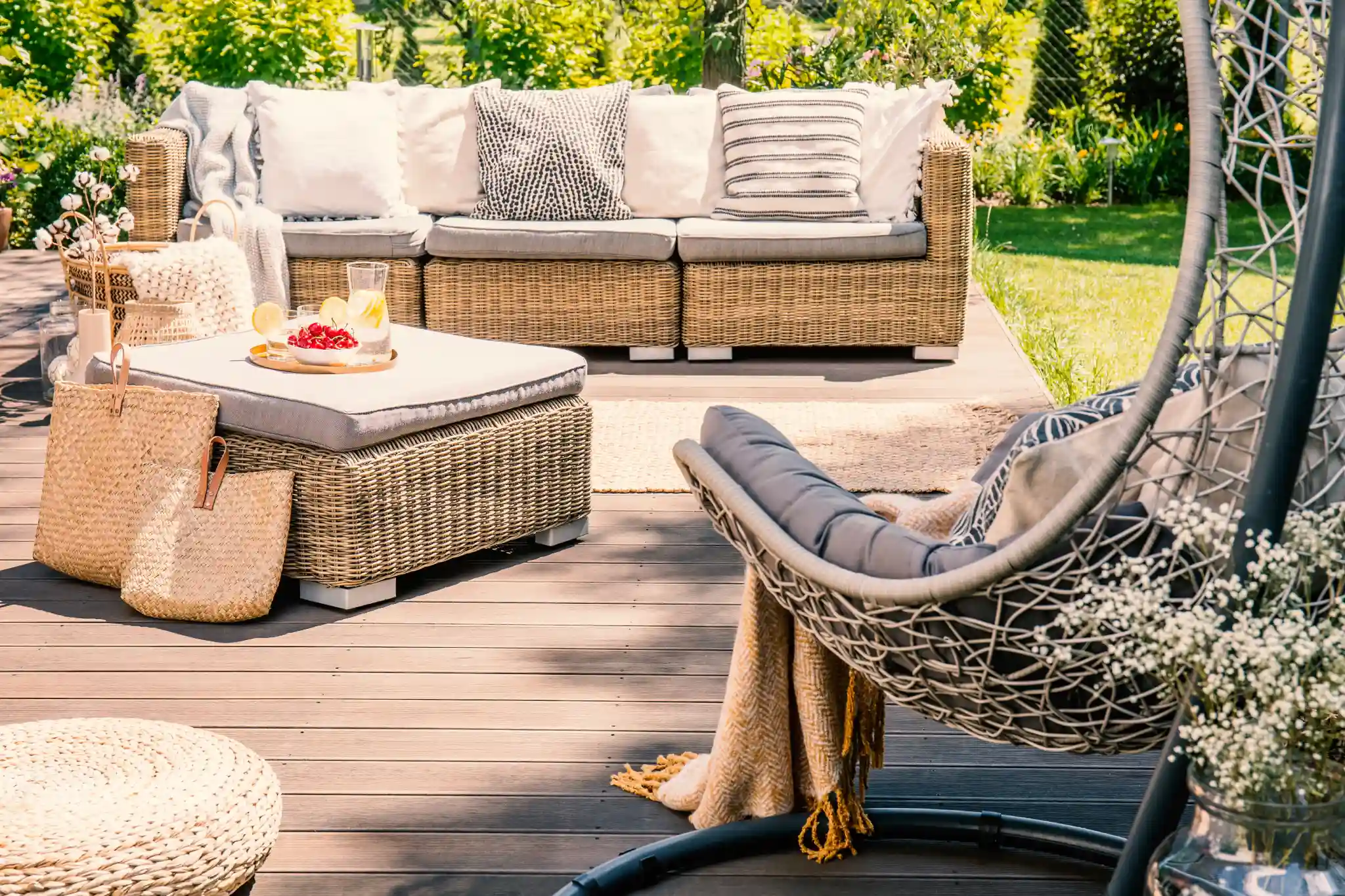 Decks And Patios Pillows On Rattan Couch Near Table On Patio With H 2026 01 05 06 20 27 Utc