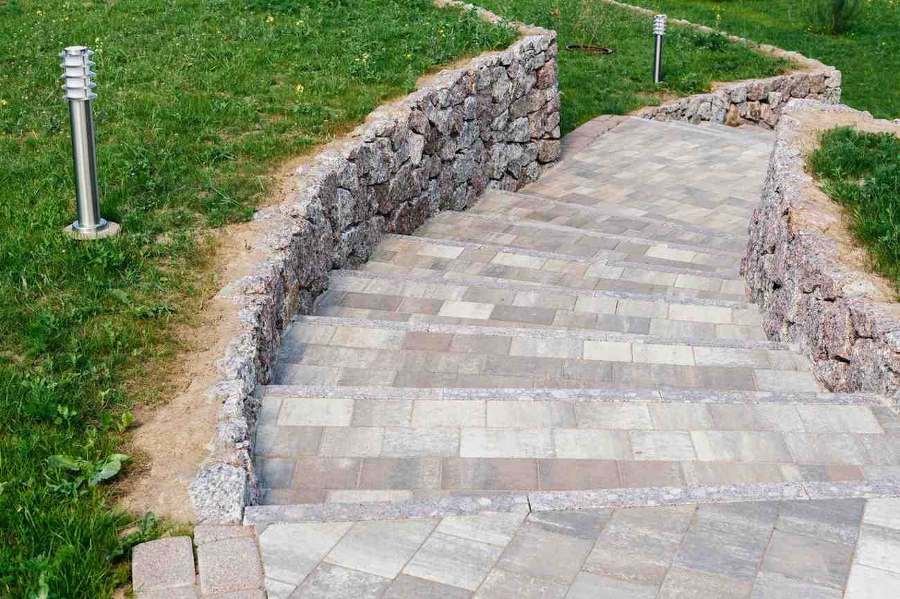 garden-stone-path-with-grass-growing-up-between-th-2026-01-07-06-31-04-utc (1)