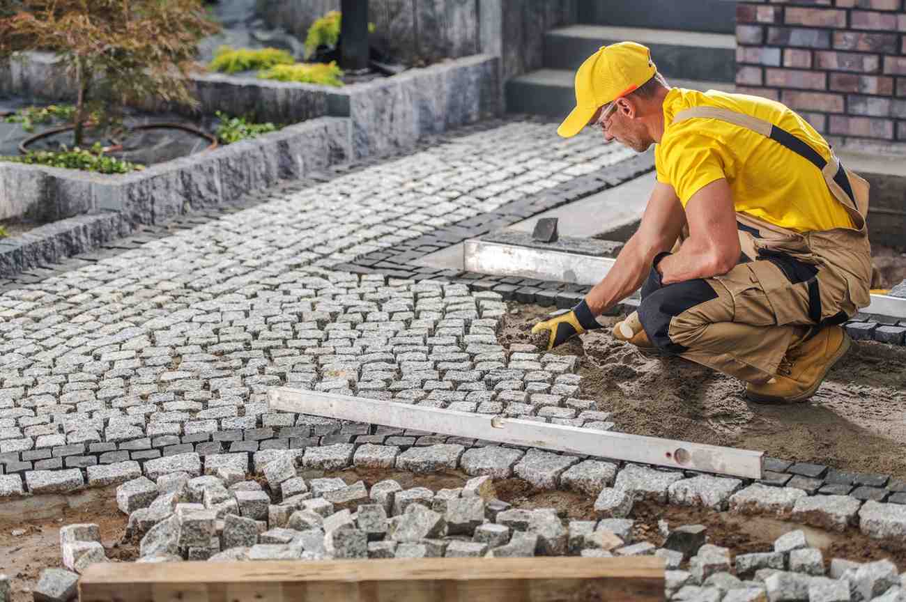 worker-laying-cobblestones-for-a-new-pathway-in-a-2026-01-09-11-52-34-utc (1)