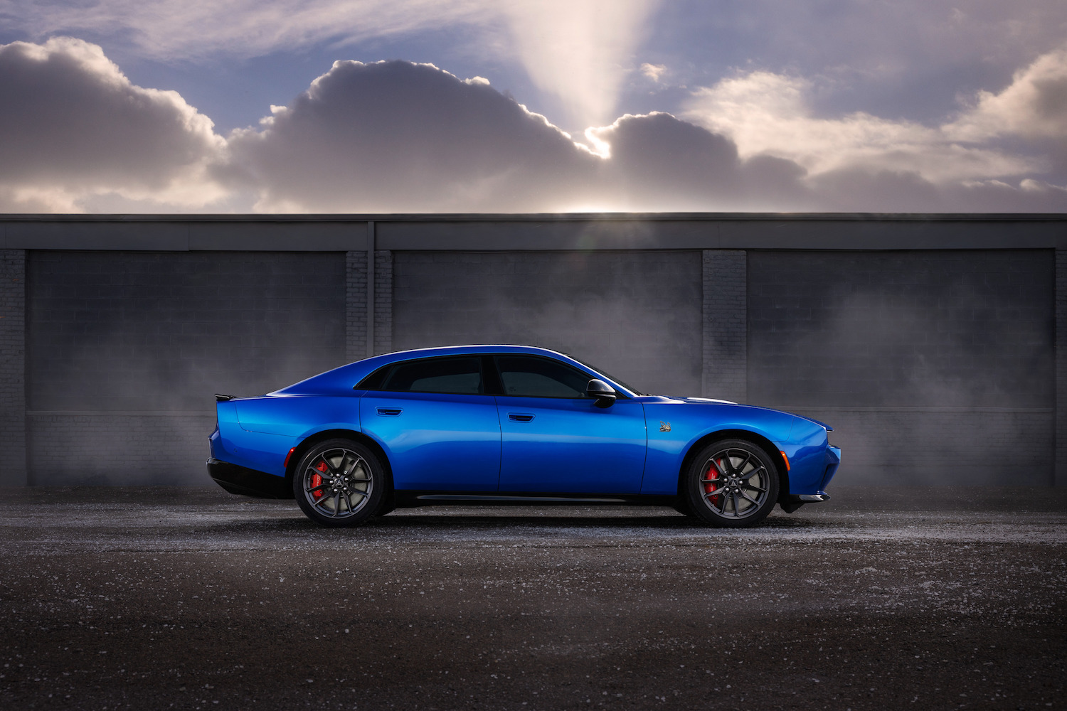 The only four-door muscle car in its class — the 2026 Dodge Charger Daytona Scat Pack Plus shown in Bludicrous exterior color.