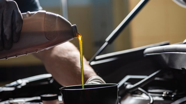 Pouring oil into the engine