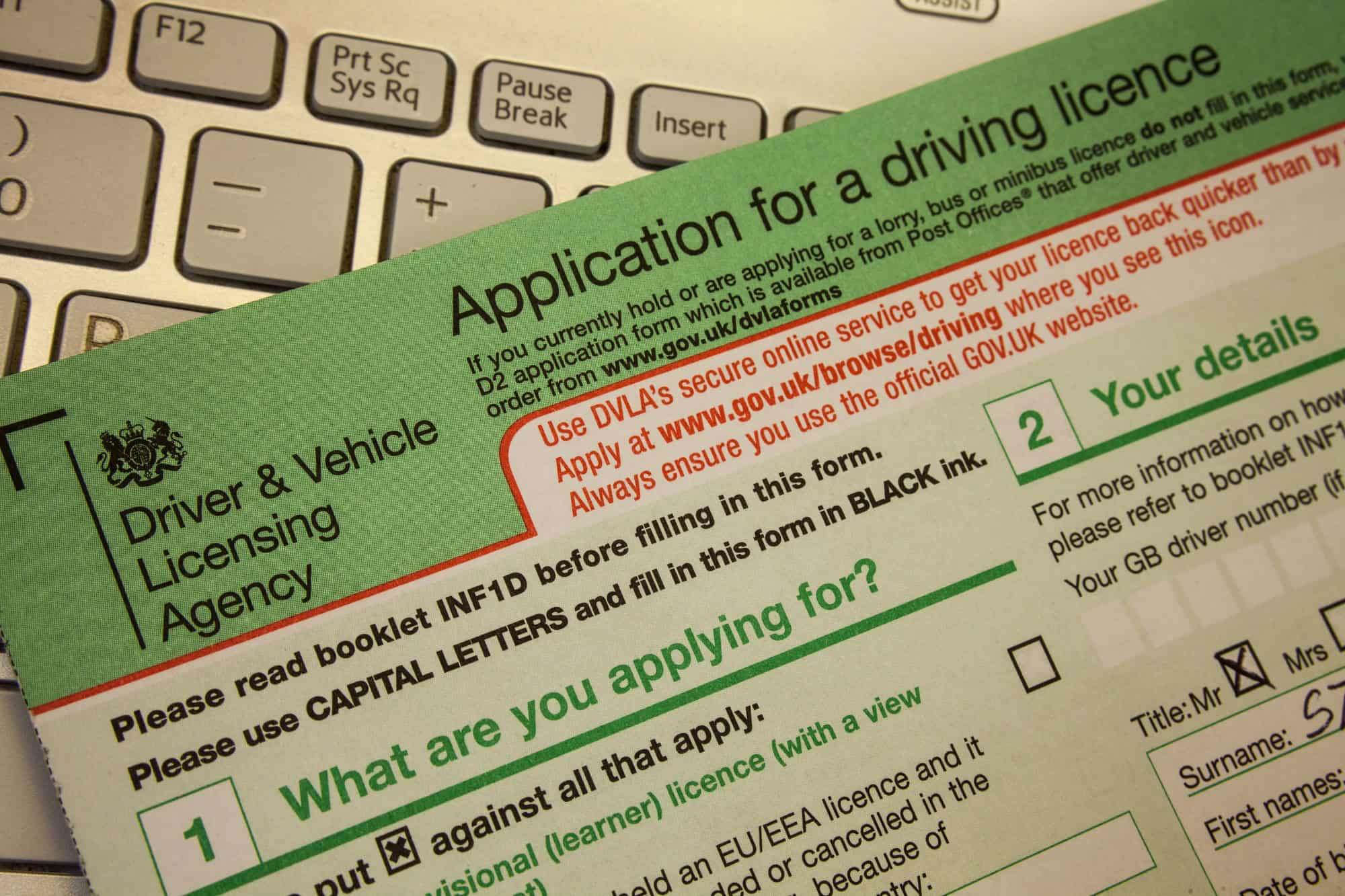 Closeup above application for a driving licence on the table.