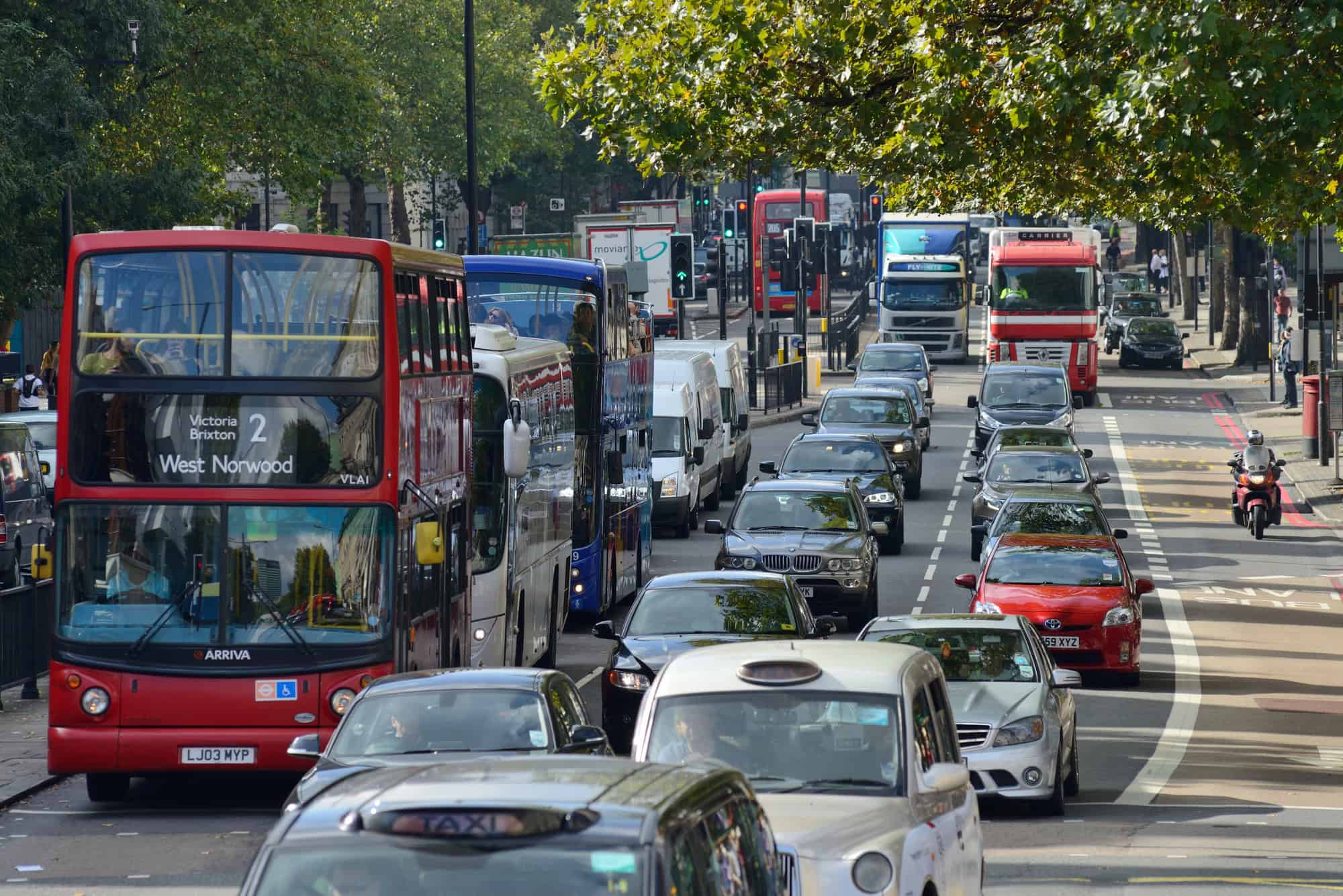 LONDON - Red double decker buses and other traffic.