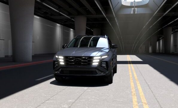 2026 Hyundai Tucson Hybrid Night AWD in Ecotronic Gray with gloss-black 19-inch alloy wheels