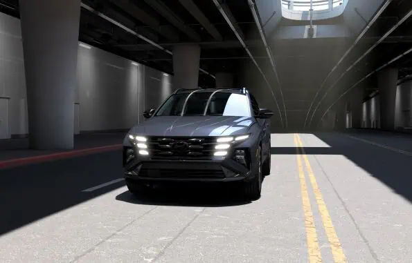 2026 Hyundai Tucson Hybrid Night AWD in Ecotronic Gray with gloss-black 19-inch alloy wheels