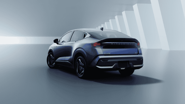 2027 Mitsubishi Eclipse Sportback electric SUV in blue, rear three-quarter view showing full-width light bar
