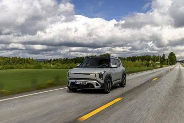 Kia EV2 driving on an open road during Norway summer EV test
