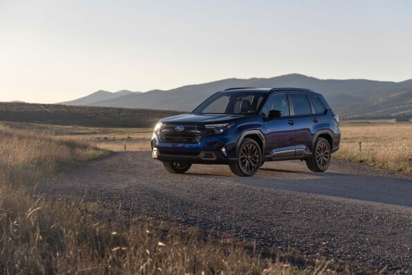Blue Subaru Forester on a rural road, recommended for teen drivers by IIHS and Consumer Reports