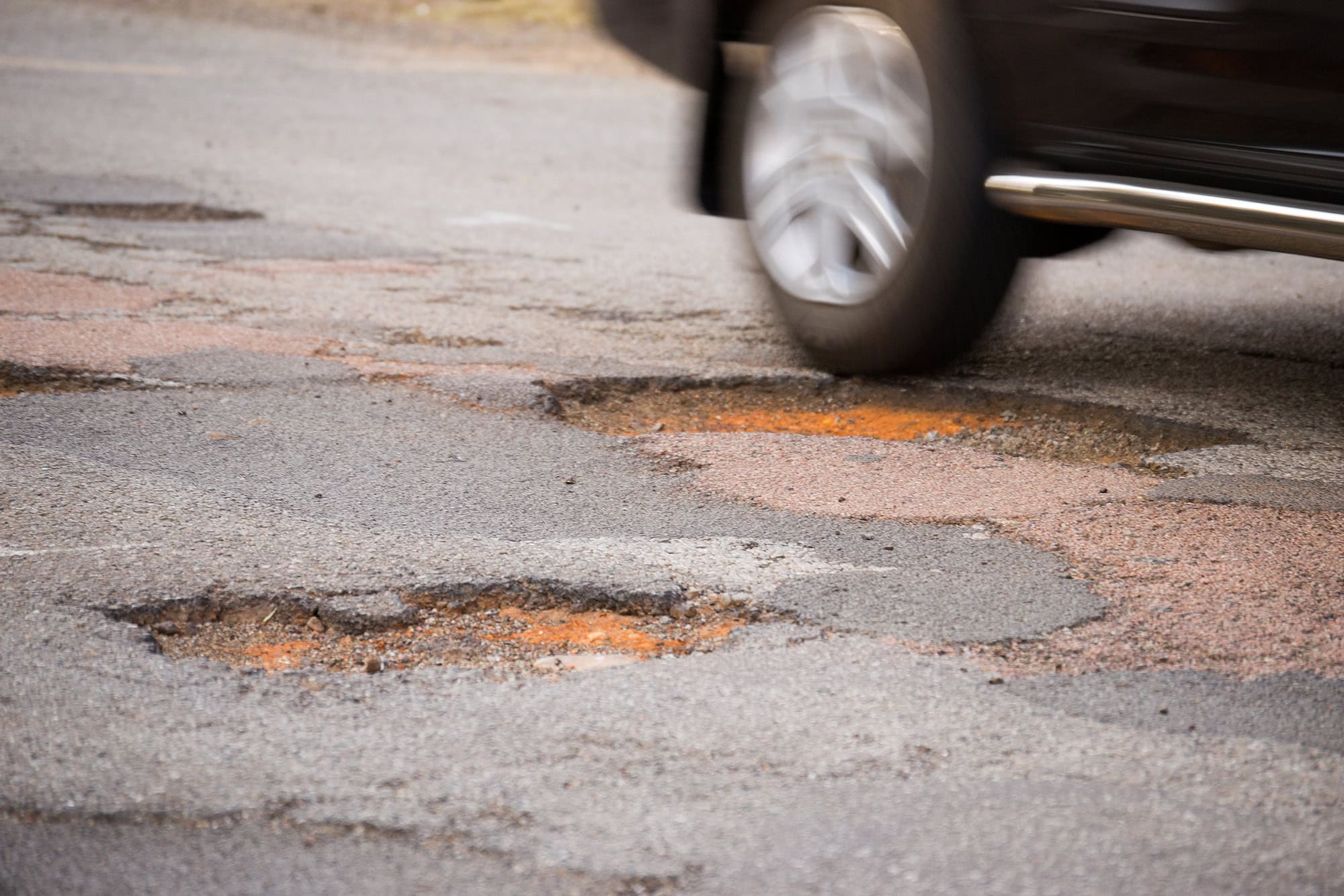 Pothole and Moving Car
