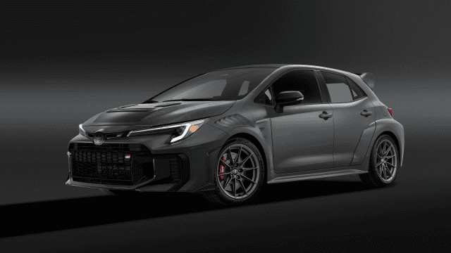 Toyota GRMN Corolla parked in a studio, front three-quarter view